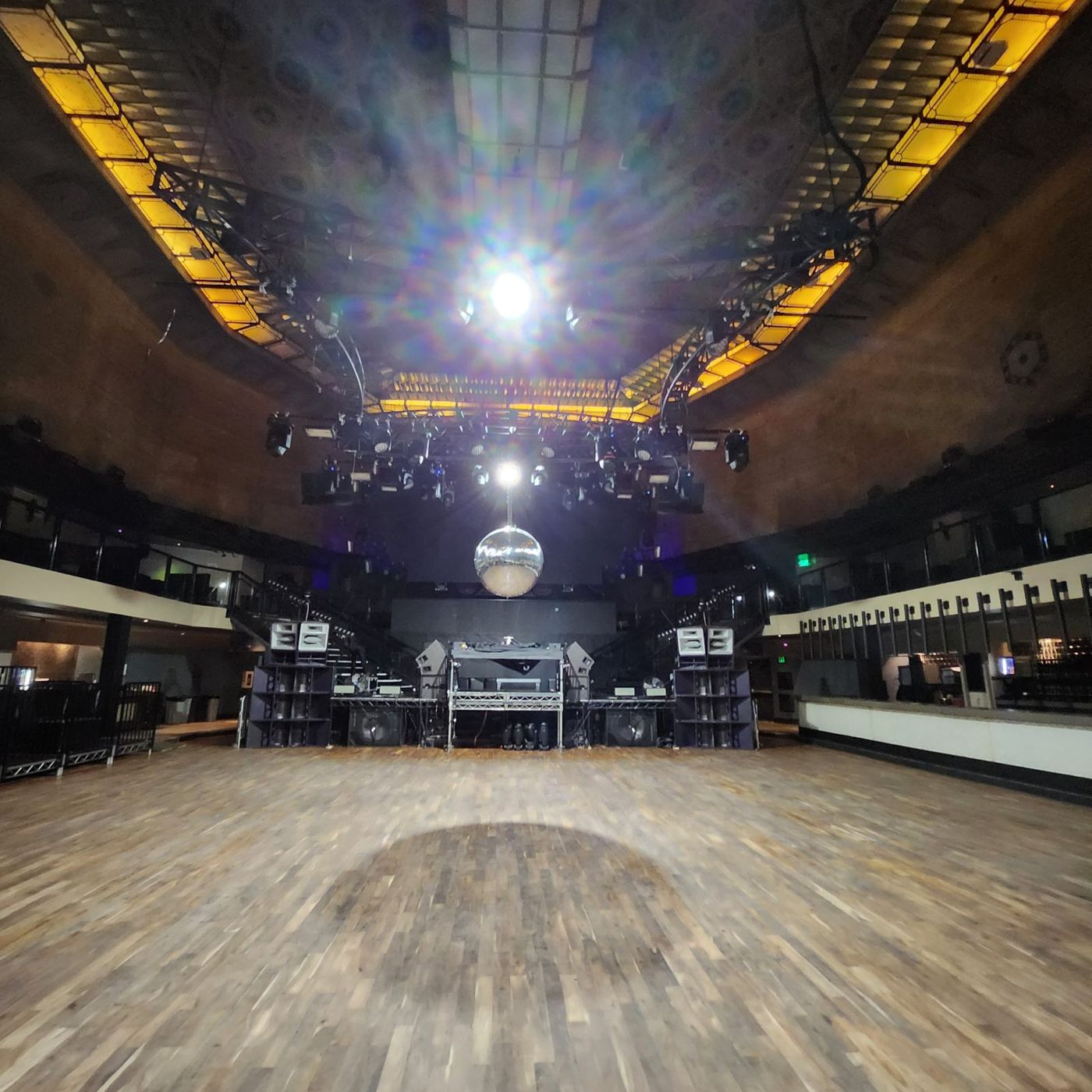 The empty venue floor under the historic ceiling